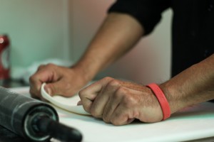 Dude Llanas rolling out his homemade tortillas. Photo by Thomas Yonash.