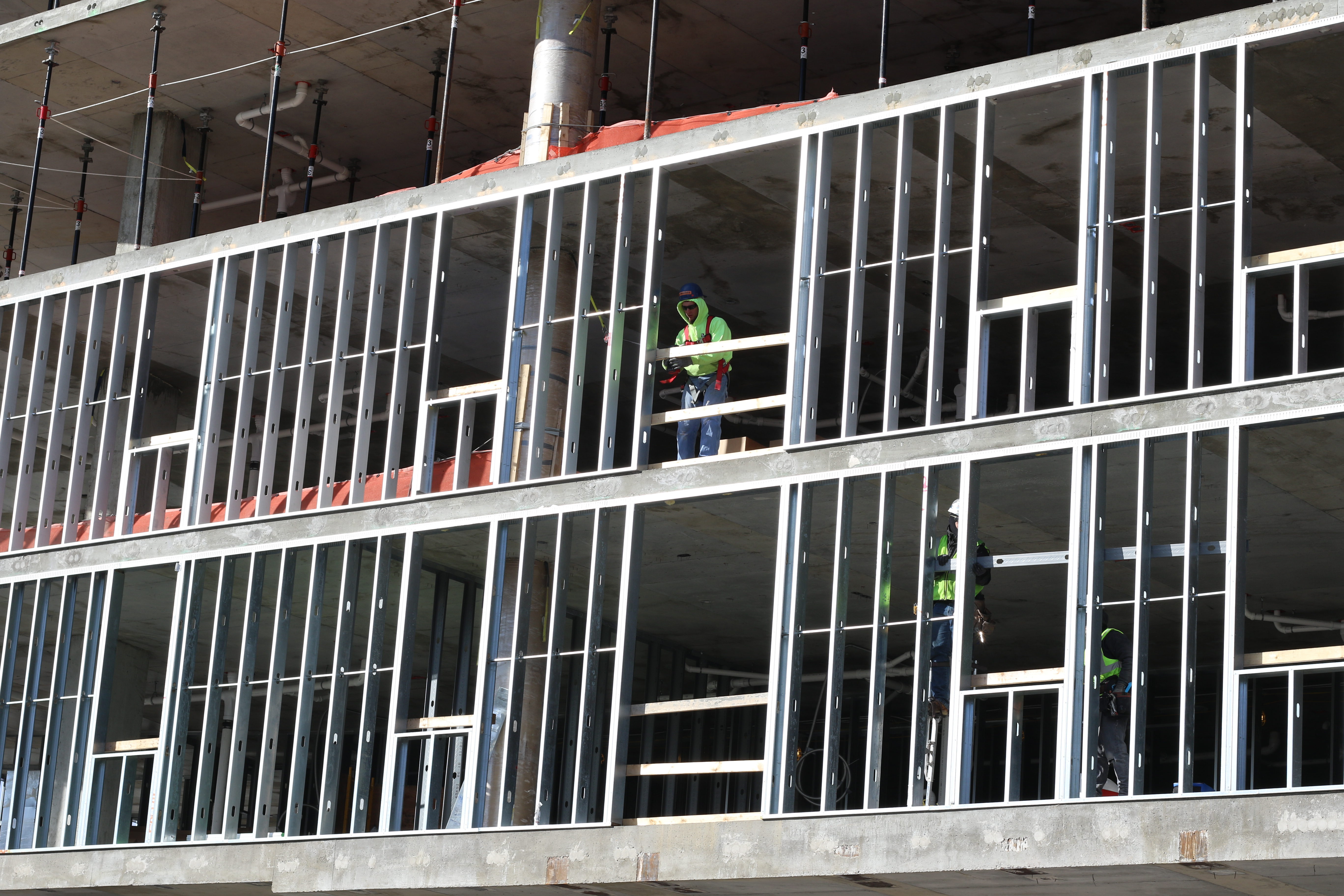 Construction workers continue work on the Uncommon Apartment Building, a new luxury student apartment building opening next year. Photo by Thomas Yonash