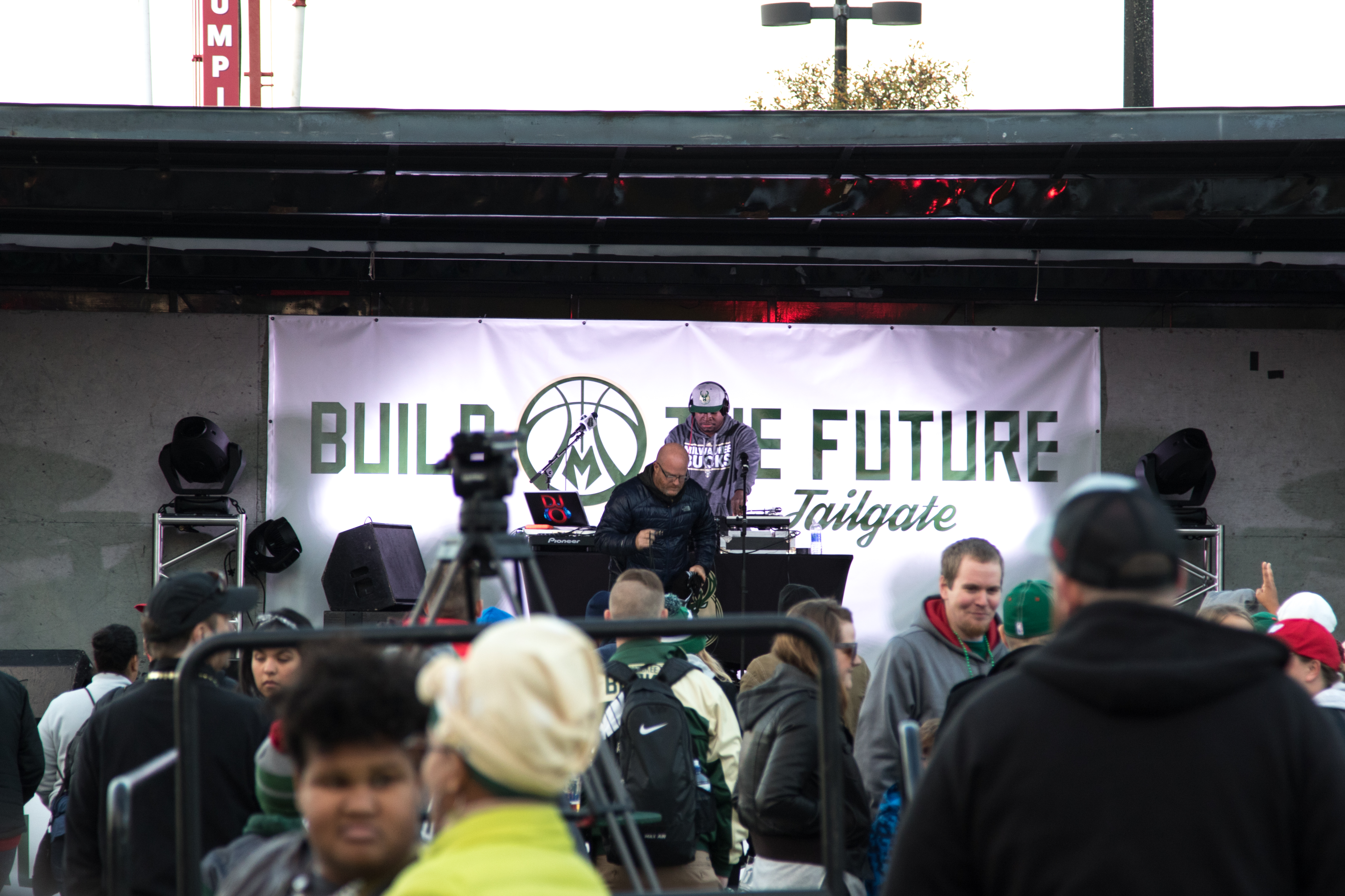 Fans gather outside of the BMO Harris Bradley Center to enjoy live music and fresh food at the “Build the Future Community Tailgate” before the Bucks victory on Nov. 7. Photo by Thomas Yonash